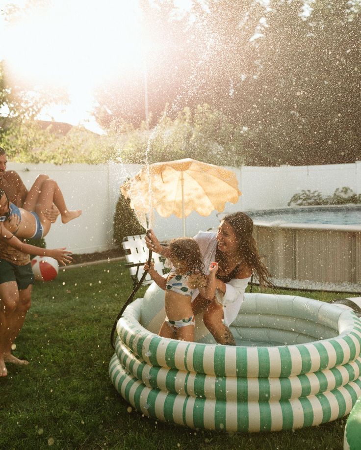 family playing in backyard