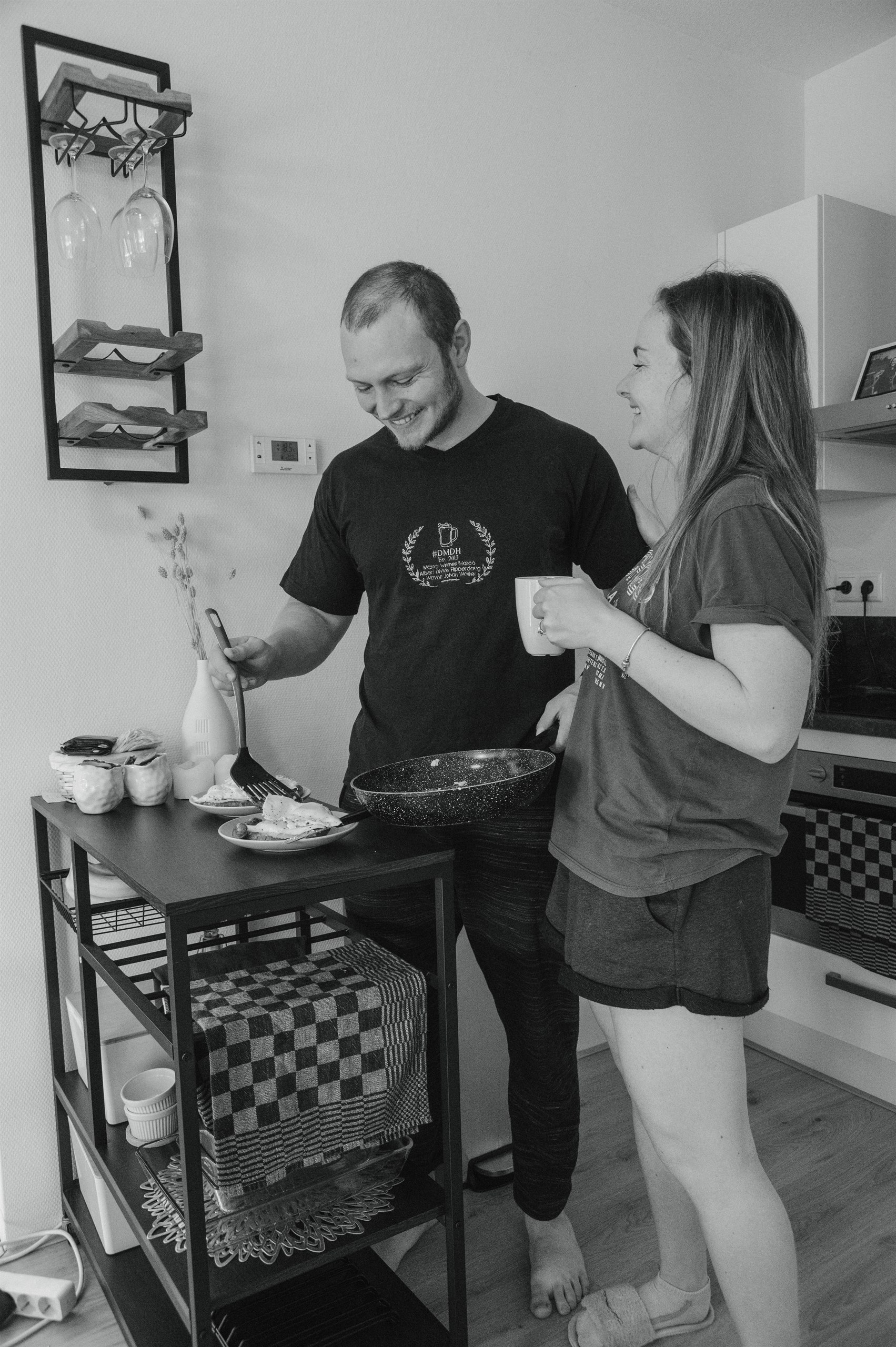 Amber and her husband cooking together in their kitchen.
