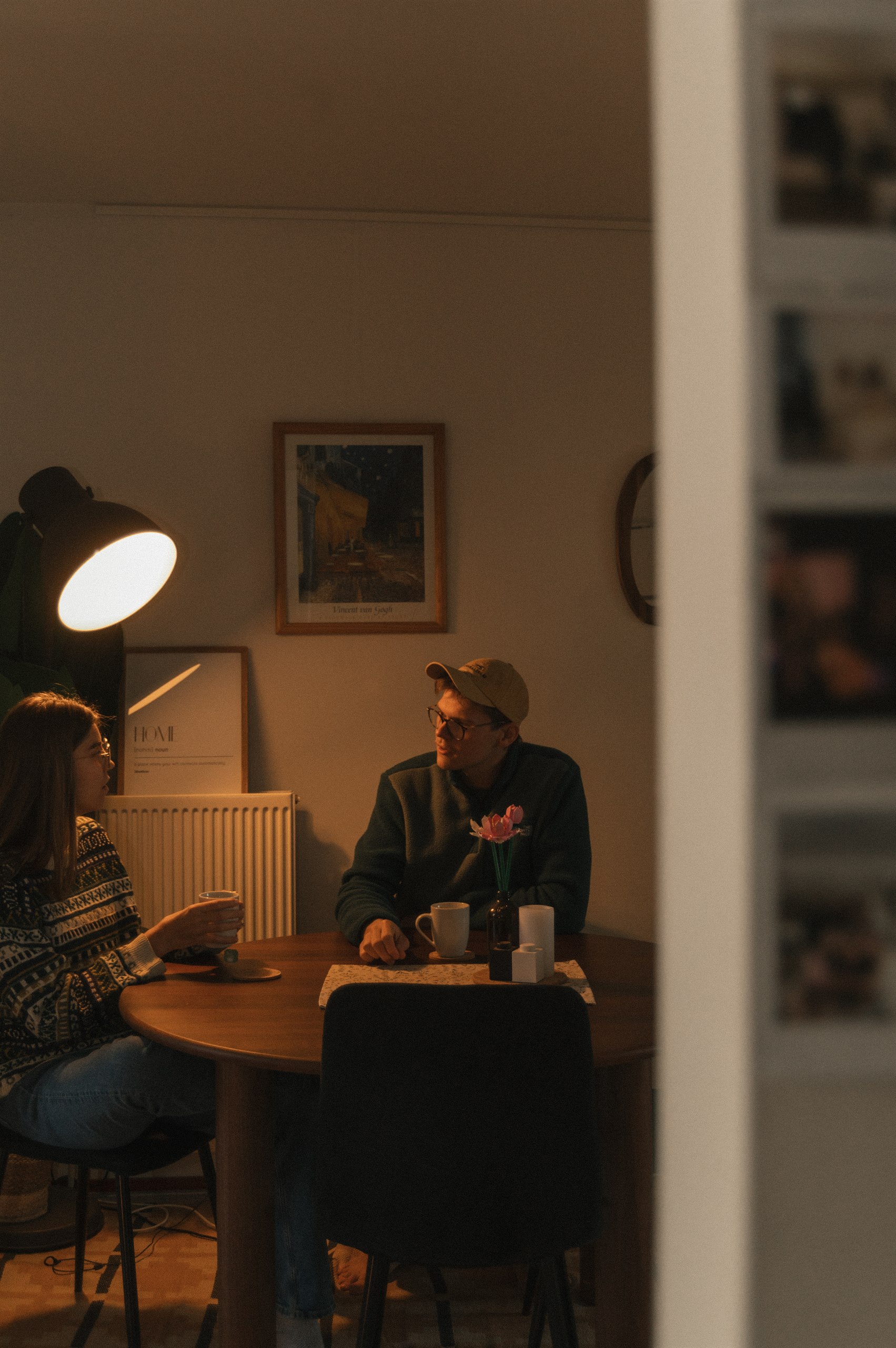 Couple sitting together at their dining table at home.