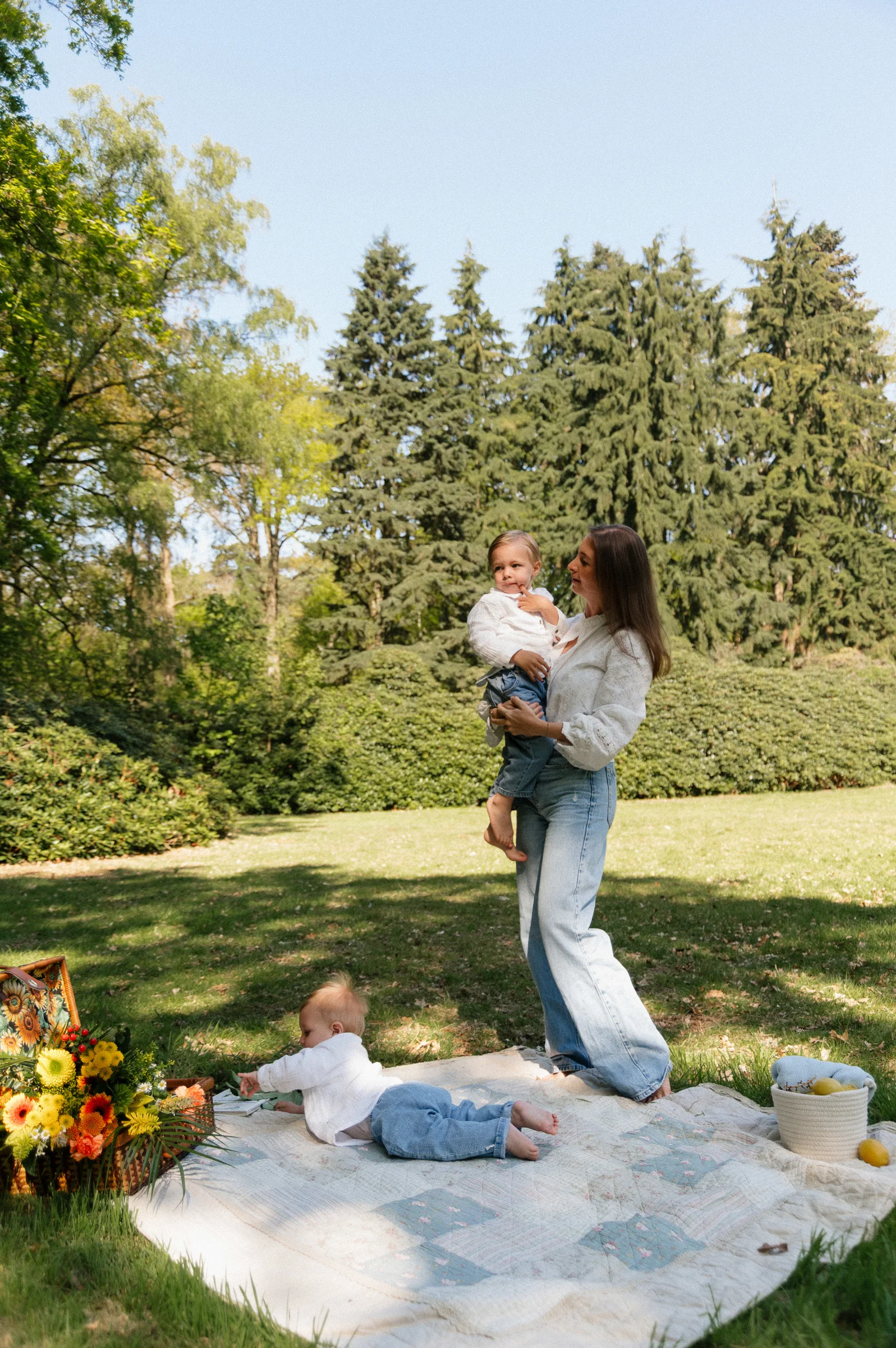 Mom and two kids having a picnic in the park