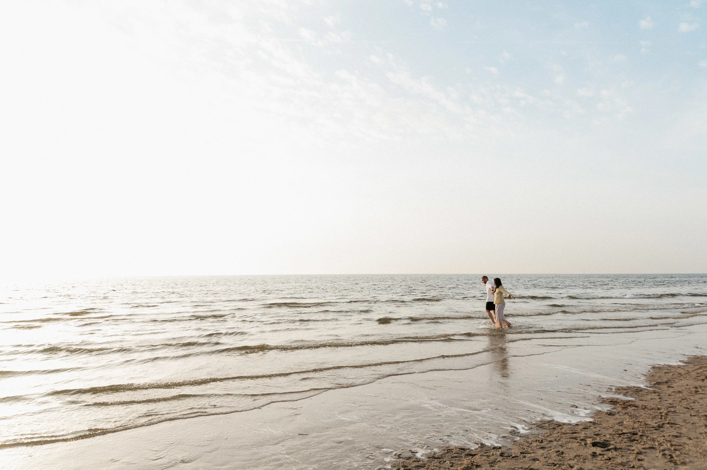 Couple walkng in water at the beach
