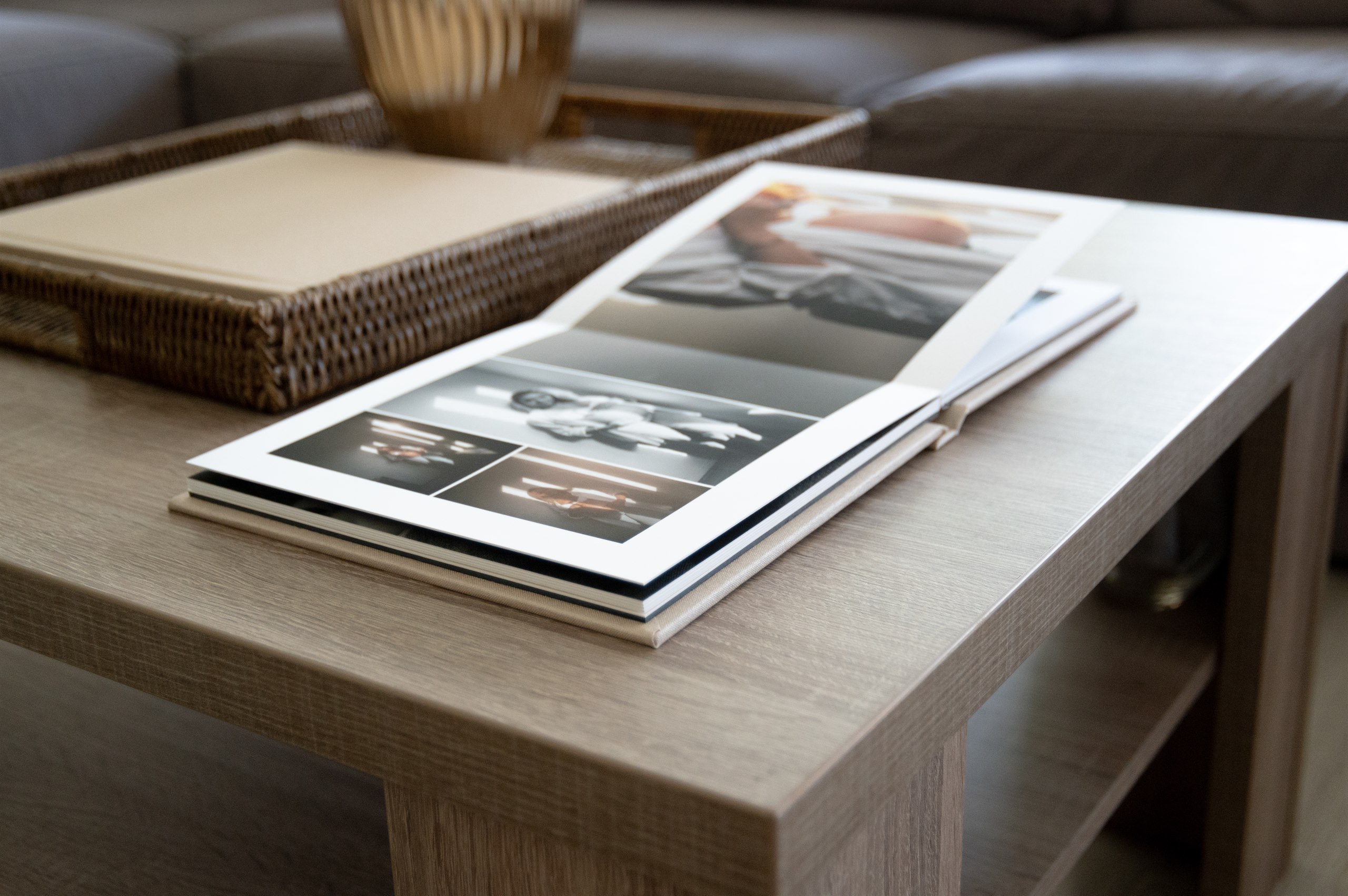 Open photo album displayed on a coffee table.